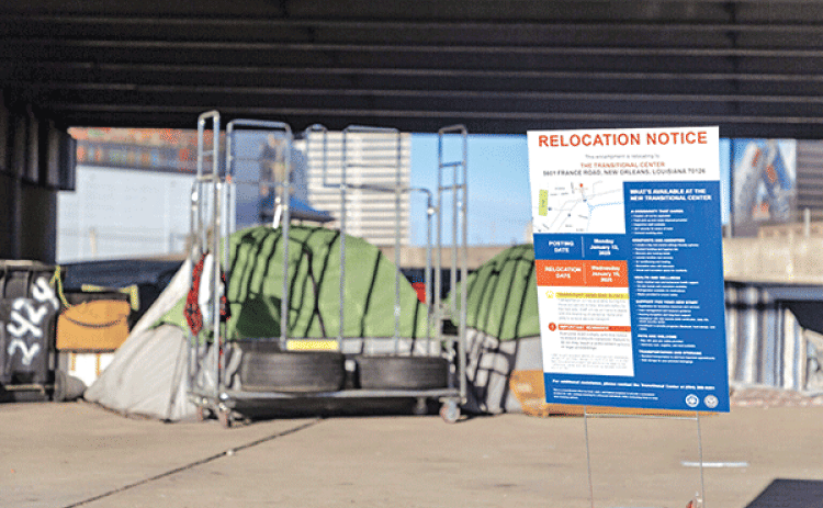 A relocation notice posted in front of a makeshift shelter at the Earhart encampment Monday, Jan. 13, 2025. Those living at the underpass will be transported Wednesday to the Transitional Center. (John Gray/Verite News)