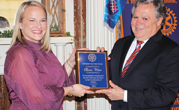 John Pucheu, right, chairman of the Eunice Rotary Citizen of the Year committee, presents Alicia Mire with the Citizen of the Year award at Wednesday’s Eunice Rotary Club meeting, (Photo by Myra Miller)
