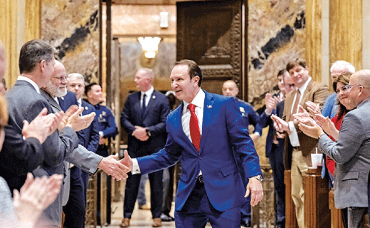 Gov. Jeff Landry shakes hands with Louisiana lawmakers while entering the State Capitol’s House chamber on Jan. 15, the first day of a special session on redistricting and election matters. (Michael Johnson/The Advocate, Pool)