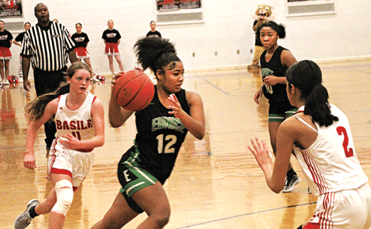 Eunice’s KeKe Monday drives to the hoop during Tuesday’s 45-33 loss to the Basile Lady Bearcats. Monday led all Bobcat scorers with 12 points, while Kyndrea Frank added nine points.