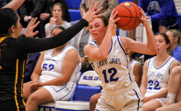 St. Edmund girls basketball team won in over time against Grand Lake Tuesday. Above is St. Ed senior Caroline Lavergne. (Photo by Rhett Manuel)