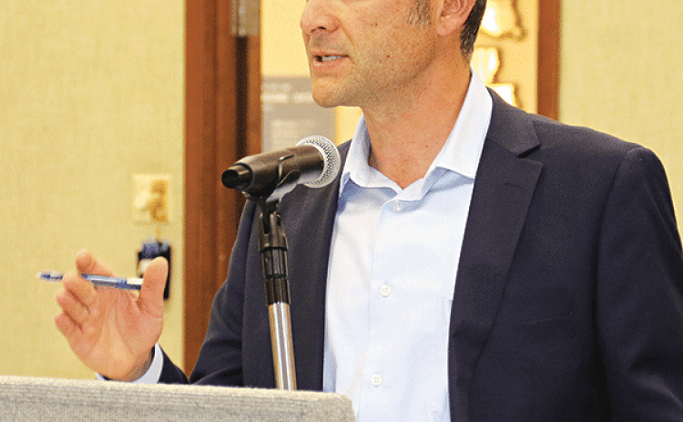 Casey Ardoin, CPA, with Kolder, Slaven & Company, discusses his firm’s audit of the St. Landry Parish School Board at a meeting on Monday in Opelousas. (Photo by Harlan Kirgan)