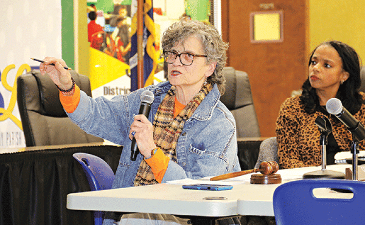 School Board member Mary Ellen Donatto, left, asks a question about a math curriculum to be introduced next school year. At right is Angela Cassimere, director of Curriculum, Assessment & Accountability. The presentation on the math program was made a meeting of the School Board’s Academic Committee on Wednesday. Donatto is chairman of the committee. (Photo by Harlan Kirgan)