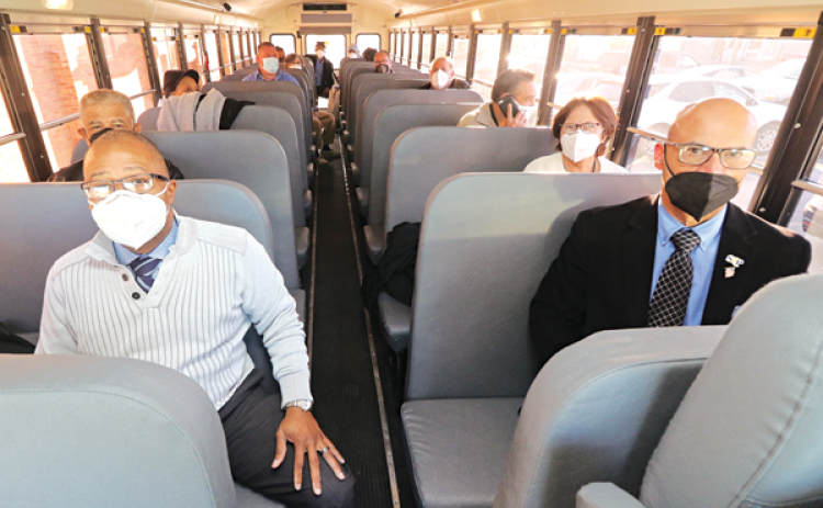 Several St. Landry Parish School Board members rode a school bus to West Feliciana Parish to view a school under construction. Seated in front are Superintendent Patrick Jenkins and Board member Myron Guillory. (Photos by Harlan Kirgan)