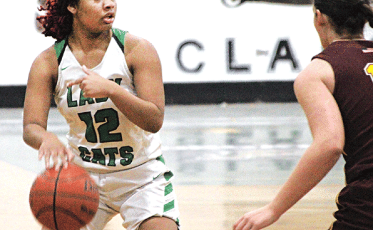 Eunice’s Akeviona Monday attempts to make a move on an Iota defender during Monday’s 49-28 loss to the Lady Dogs that dropped the Lady Cats’ overall record to 5-19 on the season. (Photo by Rhett Manuel)