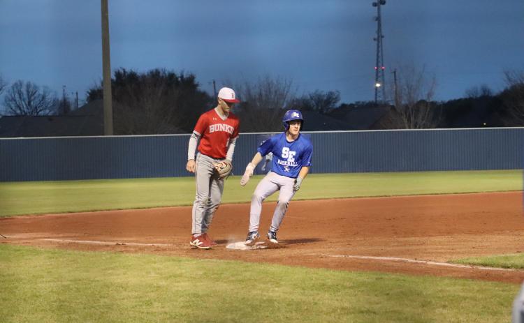 Pictured above is Lannie Reed rounding third base. (Photo by Amy Myers)