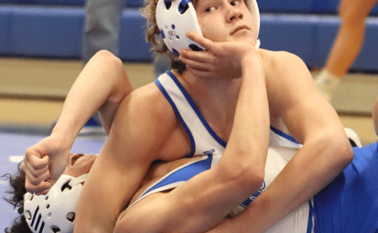 The St. Edmund High School wrestling team hosted its last home tri-dual meet on Wednesday night. Wesley Reed is shown in the process of winning his match against an Erath opponent. (Photo by Amy Myers)