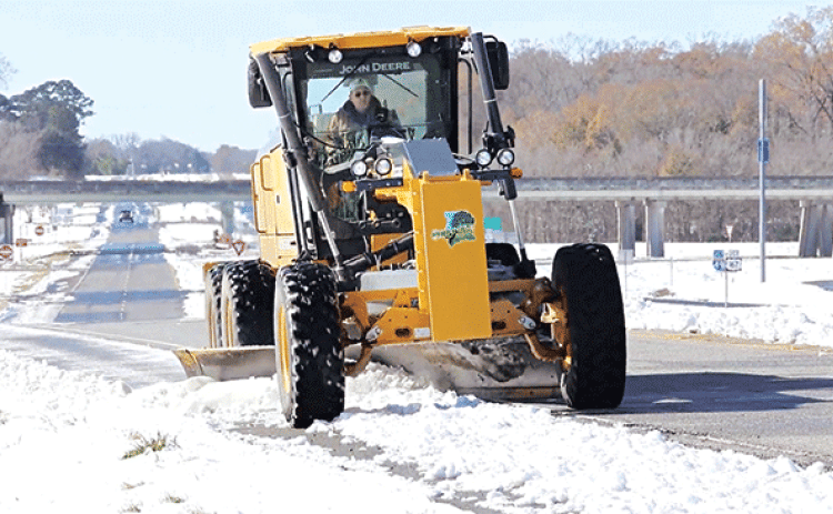 St. Landry Parish President Jessie Bellard operates a grader to plow snow off Interstate 49 near the Washington exit on Jan. 22. (Photo courtesy of St. Landry Parish Government)