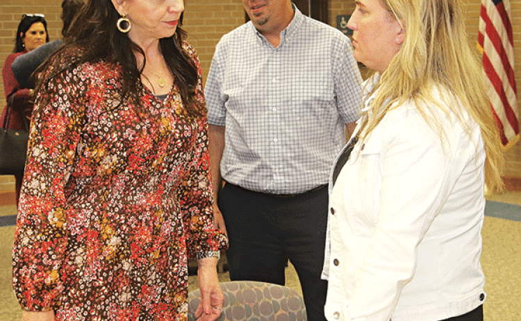 State Rep Julie Emerson, right, talks with St. Landry Parish Assessor Sherri Zeringue McGovern at the Eunice Rotary Club metting on Wednesday. At center is Eunice Mayor Scott Fontenot. Emerson, who heads the House Ways and Means Committee, spoke about tax issues at the meeting held at LSUE. (Photo by Harlan Kirgan)