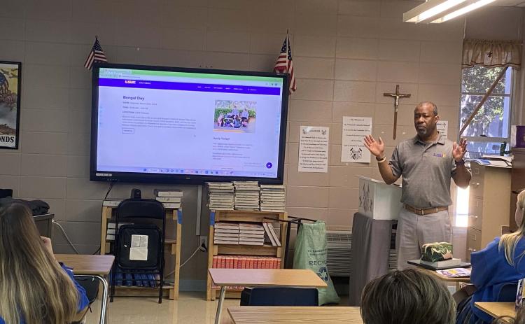 Chad Jones, institutional liaison officer at LSUE, presented different campus topics to St. Edmund High seniors.