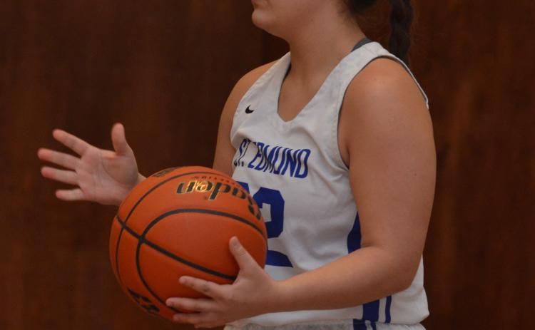 St. Edmund’s Preslee Perron looks to pass the ball. (Photo by Tom Dodge)