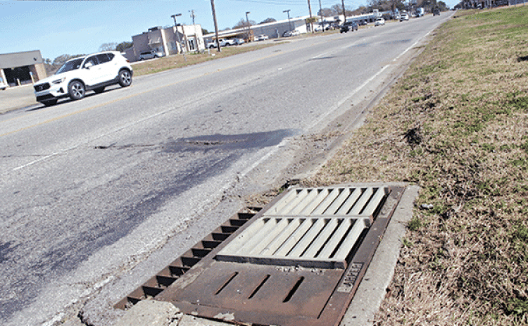The slots on the curb side drains on U.S. 190 are credited in part with sparing the road from flooding on Jan. 24 and at other times. Mayor Scott Fontenot said Eunice may have been spared the worst of the heavy rainfall, but state Department of Transportation and Development’s installation of the slotted drain lids helped with drainage. (Photo by Harlan Kirgan)