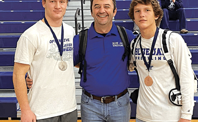 St Edmund Blue Jay wrestlers competed at the Lafayette Metro Wrestling meet on Saturday. Henry Summerlin received second place in his weight class and Cooper Berzas took home third place in his eight class. From left, are Summerlin, Coach Shane Lebleu, and Berzas. (Submitted photo)