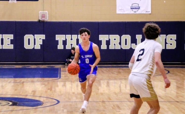 St. Edmund Senior Owen Cart brings the ball up in Friday’s game against Sacred Heart. (Photos by Sports Editor Rhett Manuel)