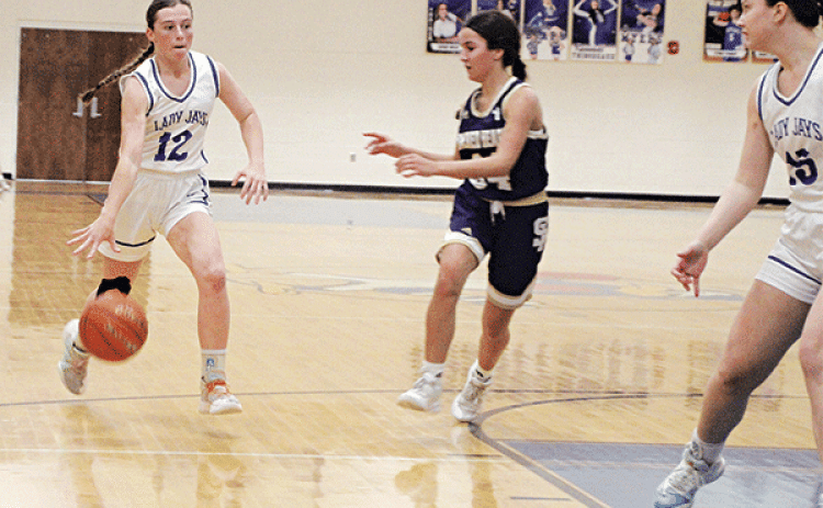 Junior guard Caroline Lavergne drives to the hoop last week against Sacred Heart. Lavergne again led the Lady Jays in scoring with 16 points in a 54-22 win over Catholic-Pointe Coupee on Tuesday night in District 5-1A play to improve St. Ed’s record to 20-3 on the season. (Photo by Rhett Manuel)