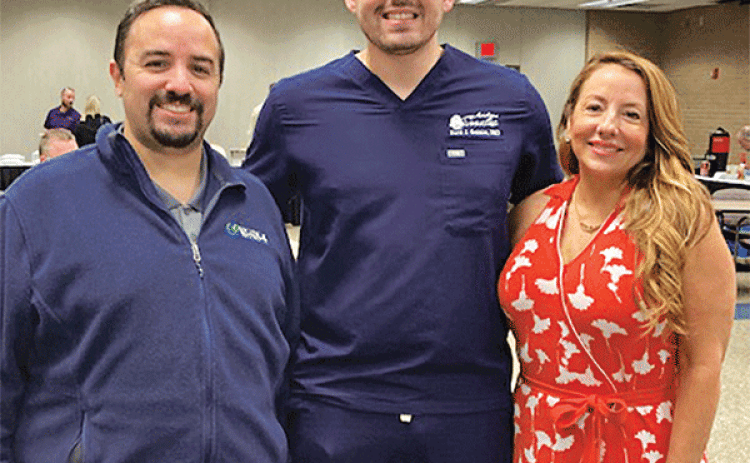 David J. Gonzalez, DMD, center with Acadiana Smiles was the guest speaker at the Eunice Rotary Club Wednesday. He had his own guests with him, from left Daniel de la Nuez, owner of Healthy Solutions & Clinic of Crowley and president-elect of the Crowley Rotary Club; and his mother Dr. Leonor Gonzalez. Leonor is an assistant professor in elementary education at LSUE. (Photo by Myra Miller)
