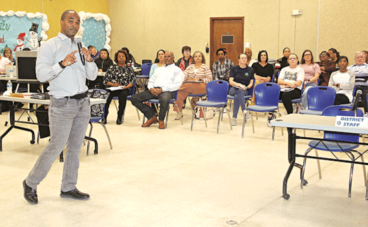 Milton Batiste III presents a cost-savings plan at St. Landry Parish School Board retreat on Saturday in Opelousas. The School Board is to meet at 5 p.m. Thursday to vote on the plan. (Photo by Harlan Kirgan)