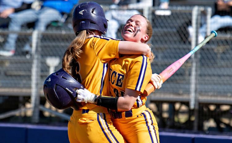 Makinzey Elisar and Kadyn Schenk celebrate. (Photo by Travis Webb)