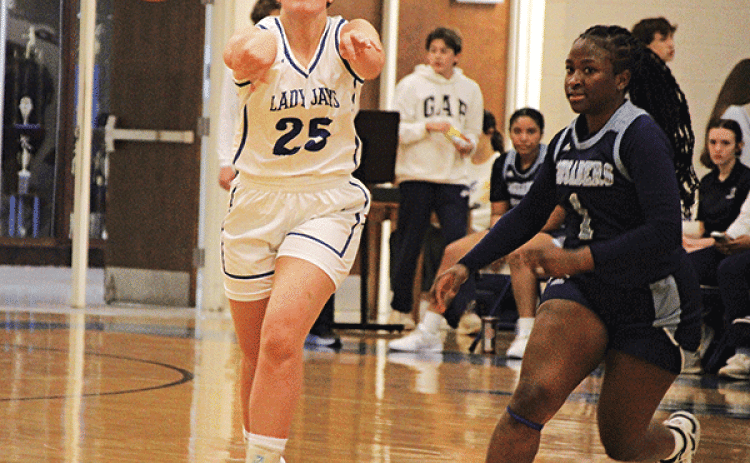 St. Ed’s senior player Millie Miller fires a pass in the Lady Jays’ 49-46 overtime win over Westminster Christian on Tuesday night. Miller finished the game with seven points but hit a crucial pair of free throws in the overtime period to help seal the win. (Photo by Rhett Manuel)
