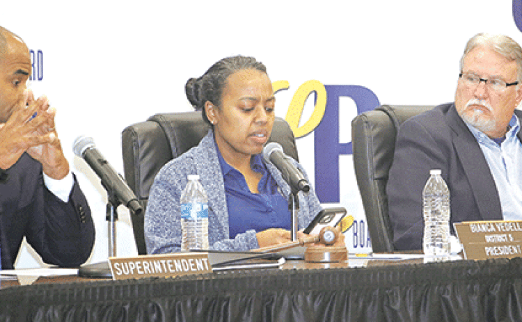 St. Landry Parish School Board President Bianca Vedell, center, explains her opposition to a parish school reorganization plan at special meeting on Thursday in Opelousas. Also shown, from left, are Superintendent Milton Batiste III and School Board Vice President Randy Wagley. (Photo by Harlan Kirgan)