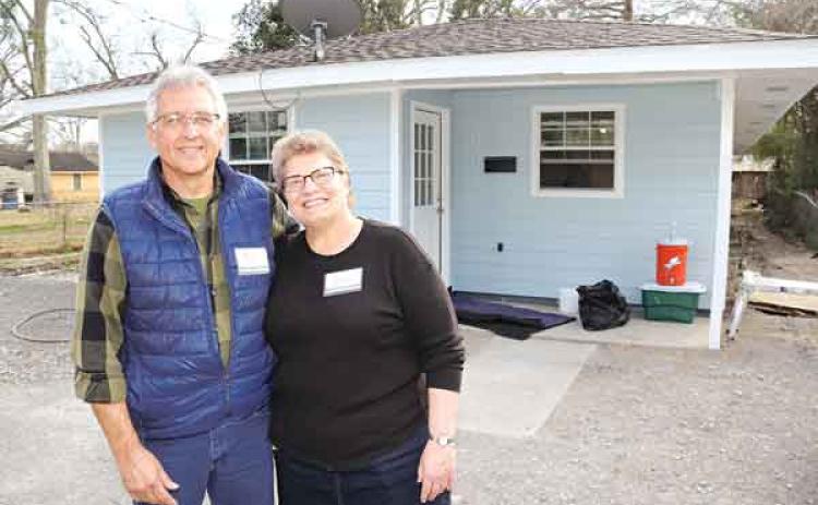 Tim and Barb Slagel of Apostolic Christian Church’s are in front of the house remodeling project on West Green Alley in Church Point on Feb. 15.  The Slagels, of Washington, Illinois, are the ministry coordinators. (Photos by Harlan Kirgan)