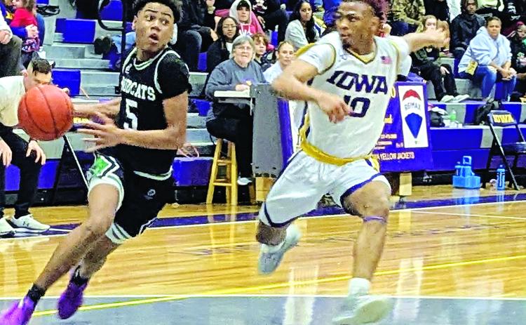 Eunice High sophomore guard Devonte Johnson attempts to drive to the basket in last Friday night’s 70-61 loss to Iowa I. District 3-4A play. Johnson ended the game with five points.  (Photo by Rhett Manuel)