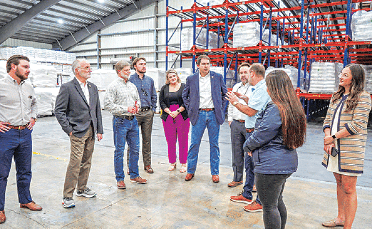 Bobby  Hanks, third from right, owner of Supreme Rice,  speaks to a delegation of state officials participating in an economic tour of Acadia Parish recently. From left are, Rep. Chance Henry; Sen. Bob Hensgens; Danny Nugier, vice president of operations, Supreme Rice; Paul Hundley, assistant to Rep. Phillip DeVillier; Taylor Henry, director of business development and events, Acadia Parish Chamber of Commerce and Economic Development; Rep. Ryan Bourriaque; Speaker of the Louisiana House of Representatives