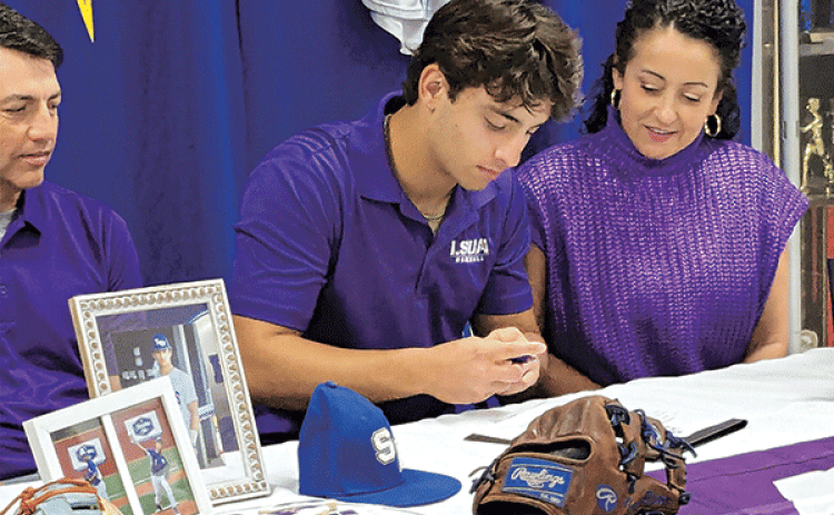 St. Edmund senior baseball player Ian Rider signs a letter of intent to play at LSUA. Rider is with his parents, Louis and Suzanne Rider. (Submitted photo)