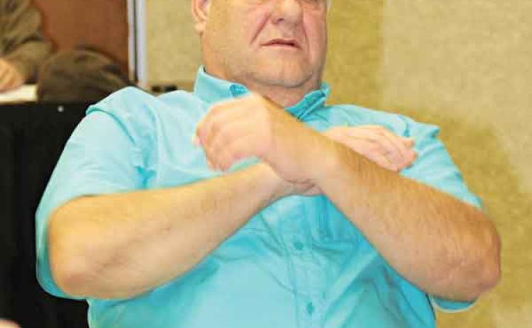 Kyle Boss, a St. Landry Parish School Board member, looks toward Superintendent Patrick Jenkins during a discussion about job descriptions at a committee meeting on Tuesday. (Photo by Harlan Kirgan)