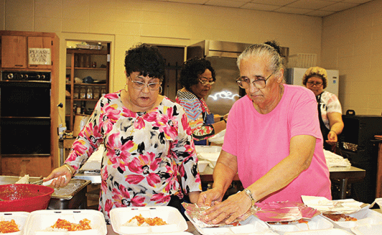 St. Mathilda Catholic Church held its Ash Wednesday fish dinners fundraiser Wednesday with pick up at the Bishop Ceaser Center. Volunteers from the community as well as from the church helped cook, prepare, and serve ticket holders. The lunch dinners with a donation of $12 included one fried catfish, catfish courtbouillon and rice, sweet green peas and a slice of cake. St. Mathilda Church will continue every Friday during the Lent season to offer the public fish dinners with a donation of $12 a dinner. Pick