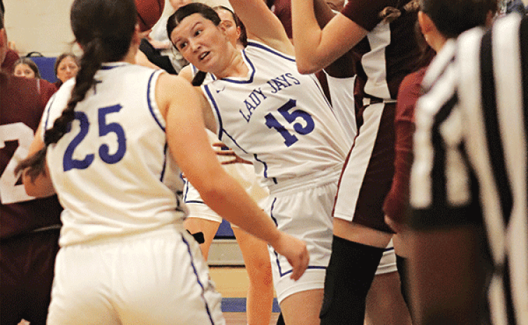 St. Edmund’s Kennedy Dubroc twists to avoid a Covenant Christian Lady Lions player. (Photo by Amy Myers)