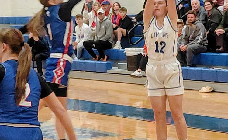 St. Edmund basketball player Caroline Lavergne fires a shot in the first quarter of the Monday 65-60 playoff loss to St. Mary’s. (Photo by Sports Editor Rhett Manuel)