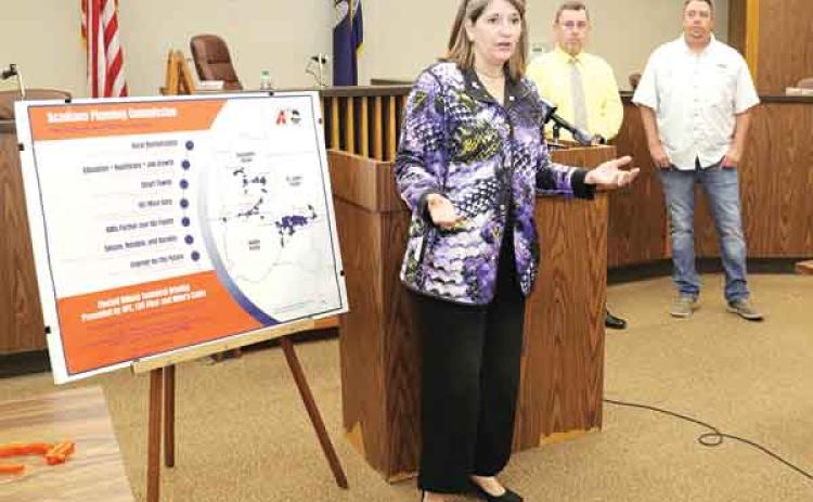 Monique Boulet, chief executive officer of the Acadiana Plannning Commission, explains a project to provide fiber-optic cable in the Tri-Parish area. A $29.9 million federal grant and the participation of LUS and Allen Cable will mean the installation of about fiber to about 22,500 households. At right are Parish President Jessie Bellard and Eunice Mayor Scott Fonteot.(Photos by Harlan Kirgan)