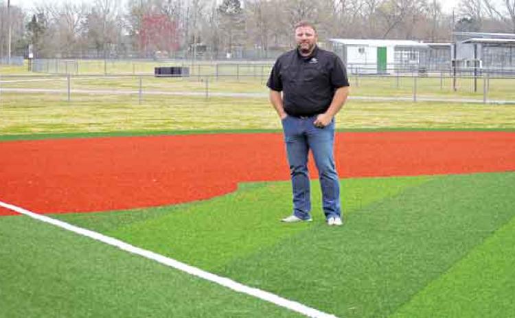 Robert Johnson, the city’s recreation director, stands on the infield turf at the Recreation Complex. (Photo by Tom Dodge)