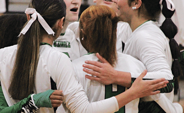 Huddling during the Iota match, are Lady Cats, facing the camera, from left, Destiny Labbe, Ava Grace Brown and  Brooklyn Darbonne. Backs to the camera, from left, are  Jaylee Randall, Lainie Ortego and De’miyah Reed. (Photo by Rhett Manuel)