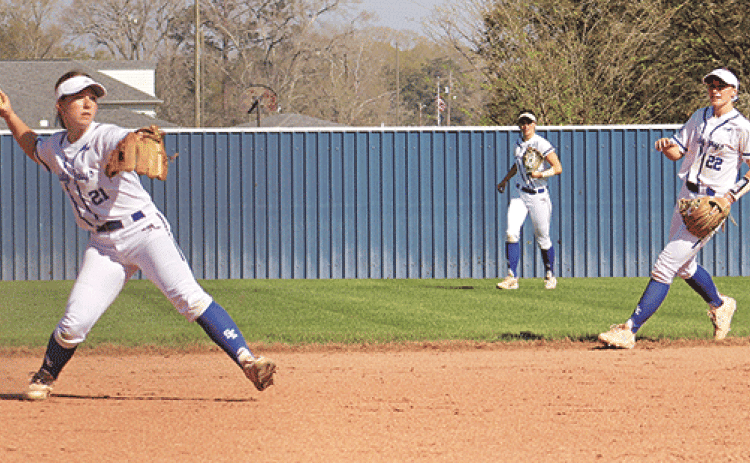 Kourtney Lavergne fielding a ball to make the out at first in a 7-6 win over South Beauregard. (Photos by Amy Myers)