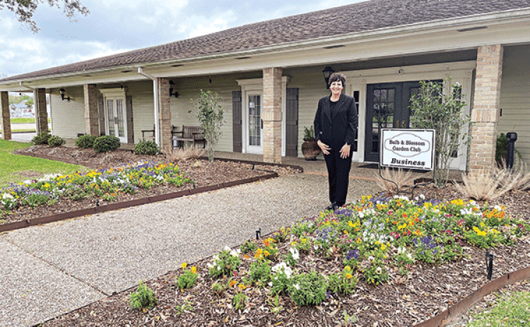 Business Yard of the Month selected by the Bulb & Blossom Garden Club went to Ardoin’s Funeral Home located on West Laurel. Kim LeDoux Fontenot, manager, is pictured. The funeral home features flowering beds  of multi-colored pansies, matuBusiness Yard of the Month selected by the Bulb & Blossom Garden Club went to Ardoin’s Funeral Home located on West Laurel. Kim LeDoux Fontenot, manager, is pictured. The funeral home features flowering beds  of multi-colored pre pink azaleas, and bridal wreath shrubbery.