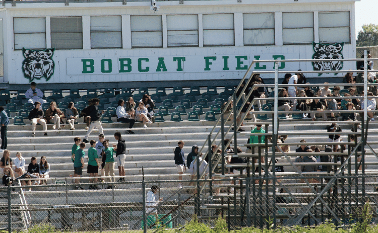 Eunice first-responders were dispatched to Eunice High School Wednesday morning in response to a bomb threat. Roads to the school were blocked. Students are shown in the football stadium as the threat is investigated. (Photo by Harlan Kirgan)