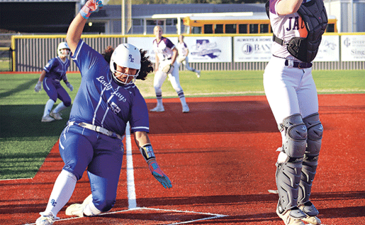 Reagan Gradney scores a run for St. Edmund, but the Lady Jays fell short of Iowa. (Photo by Amy Myers)