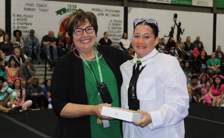 There were three different drawings during the Renaissance Pep Rally and the grandest and biggest prize was drawn at the conclusion of the program. Winning the grand prize of an Apple iPad was Camryn Gradney, a junior. She is pictured with Principal Irma Trosclair.