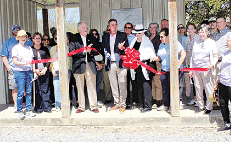 Eunice Mayor Scott Fontenot, center, was joined by former mayors Kenneth Peart and Lynn LeJeune at a ribbon-cutting to celebrate the completion of Bulb and Blossom Garden Club tree marker project at the Eunice Nature Trail and Walking Paark on Tuesday. (Photos by Myra Miller)