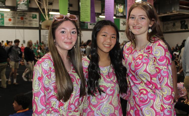 Vivian Fontenot, a freshman; Brooklynn Nguyen, a sophomore; and Destiny Labbe, a junior; dressed as in the past decades for the school’s Renaissance Pep Rally held Friday morning.