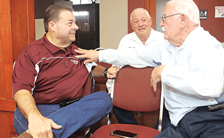 The St. Landry Parish Council meeting on Wednesday was a perfect time for some conversation for, from left, Richard LeBouef, Kenneth Vidrine and Earl Taylor. (Photo by Harlan Kirgan)