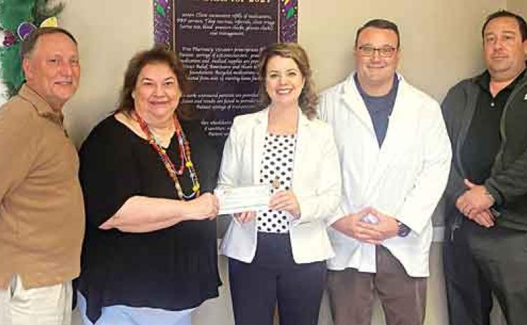 From left, are Randall Vigee, JD Bank, commercial lender; Yancy Fontenot, director for Eunice Community Health Center; Kitty Jo Deshotel, JD Bank Eunice, branch manager; Glynn Michaud, pharmacist for the health center; and Ryan Vidrine, JD Bank commercial lender. JD Bank donated $3,000 to the health center. (Submitted photo)