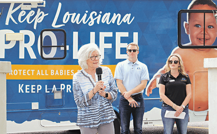 By Harlan Kirgan Editor Louisiana Right to Life brought its tour to Eunice on Thursday asking that the public sign a petition and contact legislators to keep exceptions for rape and incest from becoming legal reasons for abortions.  In front of St. Anthony of Padua Catholic Church at noon, about 60 people, including seniors from Saint Edmund High School, gathered for the 50-stop tour that began in Galliano and ends in Springhill.  The tour in a recreation vehicle started about four weeks ago and is to conti