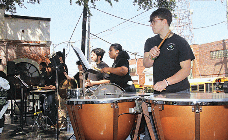 Ty Vidrine plays the timpani during the Eunice High Band performance on Saturday.
