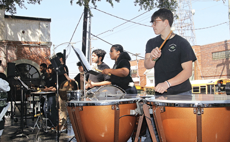 Ty Vidrine plays the timpani during the Eunice High Band performance on Saturday.