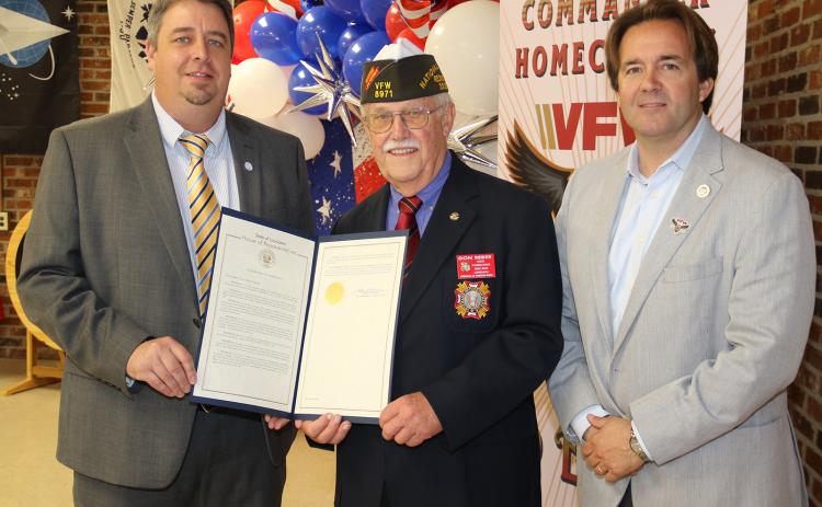 State Rep. Phillip DeVillier, right, presented an expression of condolences to the family of former Eunice Police Chief Gary “Goose” Fontenot to the chief’s son, Mayor Scott Fontenot, left, during VFW State Commander Don Reber’s State Commander Homecoming on April 1. The statement gave history of the former chief’s service that included service in the Army during the Vietnam War at the age of 17. The chief was elected to three terms. Chief Fontenot also served as commander of VFW Post 8971. (Photo by Harlan