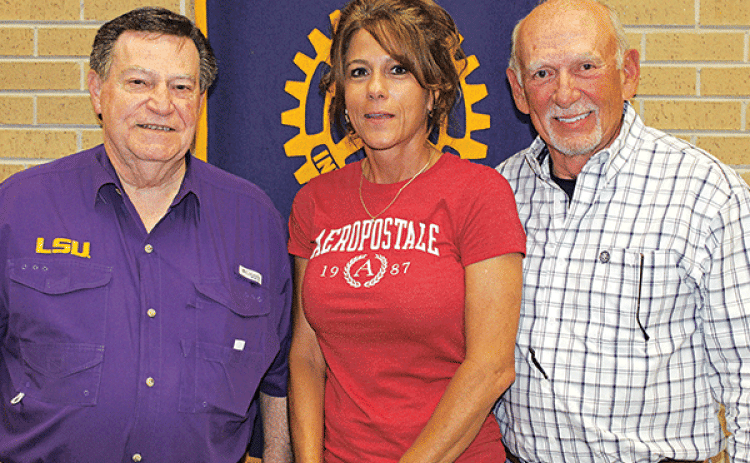 Dr.  Ned Fruge was the guest of Rotarian Leah Harris Wednesday at the Eunice Rotary Club meeting. From left are Rotary Club President Ellis Daigle, Leah Harris and Fruge. (Photo by Myra Miller)