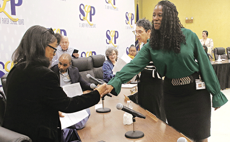 St. Landry Parish School Board finance director Shaun Grantham, right, announced at the April 4 School Board meeting she is leaving the school district, After the meeting she said she accepted the position of finance director for the Acadia Parish Police Jury effective April 29.